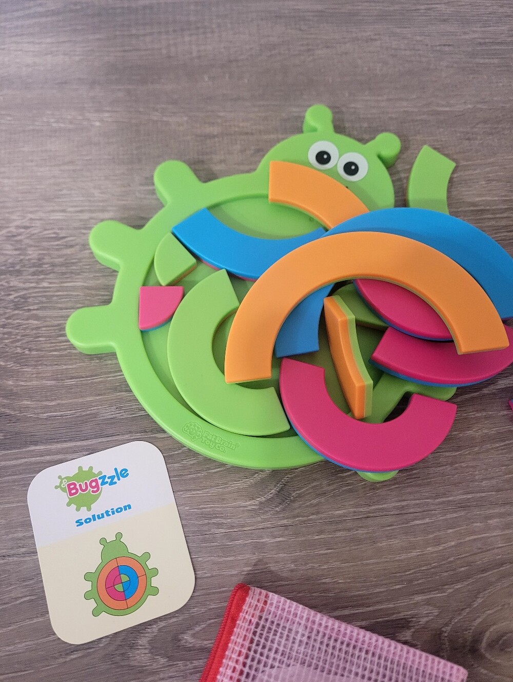 BUGGZLE Color Ring Puzzle - Green Multicolor Kids Toy by Fat Brain Toys